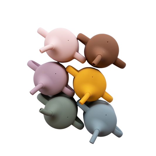 Set of colorful silicone cups on a white background