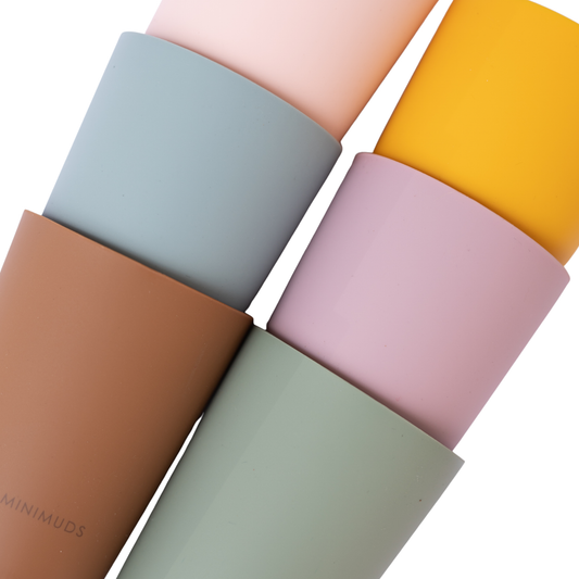 Set of colorful silicone cups with 'MINIMUDS' branding on a white background