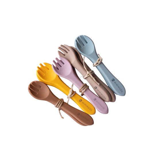 Set of colourful silicone cutlery sets on a white background