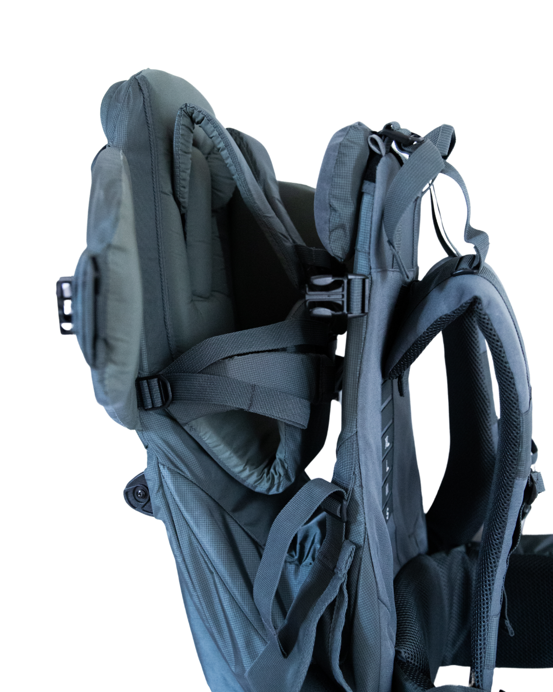 Close-up of a gray child carrier backpack with straps on a white background